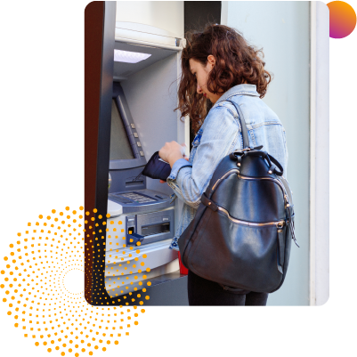 Picture of a woman using her Wellby ATM card at a walk up ATM
