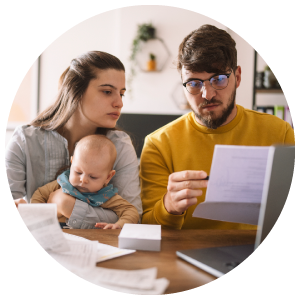 A young family with a baby budgeting and auditing their monthly expenses