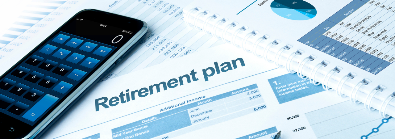 retirement paperwork and a calculator used to plan for your retirement