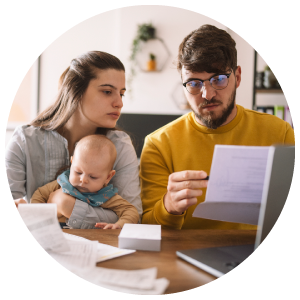 A young family with a baby budgeting and auditing their monthly expenses